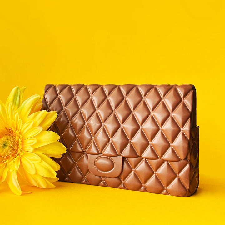 CHOCOLATE PURSE  ONLY AVAILABLE FOR  PURCHASE IN OUR  RETAIL STORES.