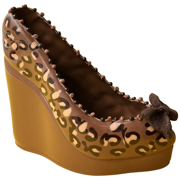 CHOCOLATE WEDGE SHOE, ONLY  AVAILABLE FOR PURCHASE IN OUR RETAIL STORES.